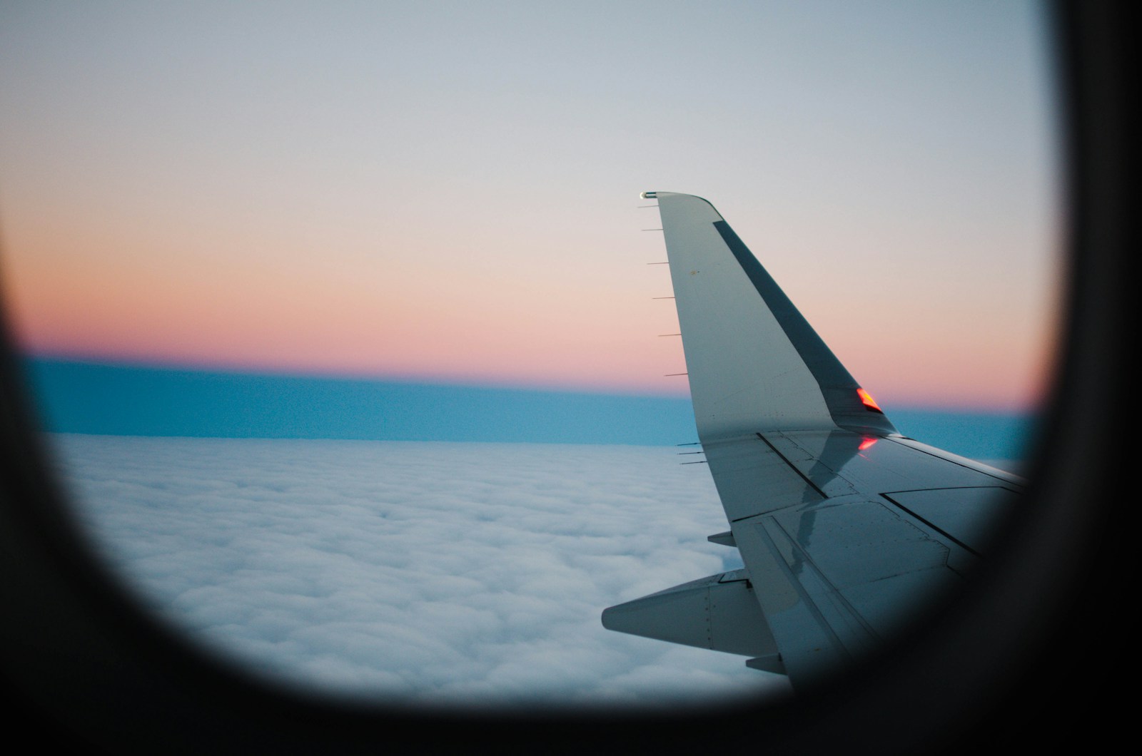 Airplane wing above the clouds